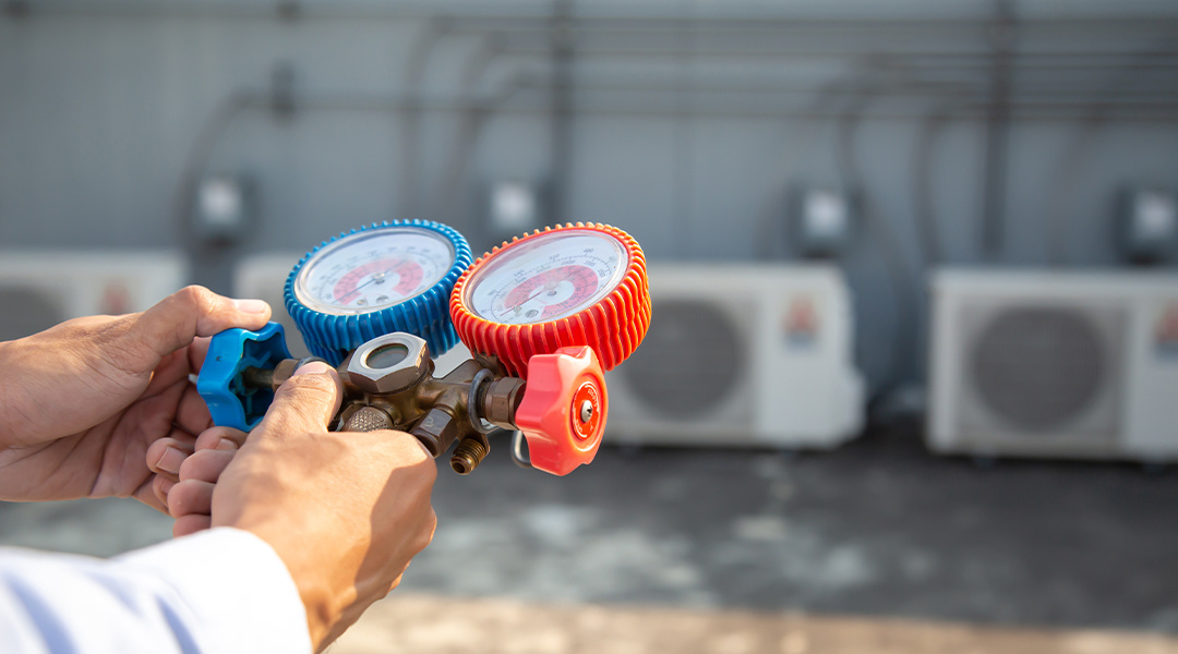 HVAC technician servicing a unit