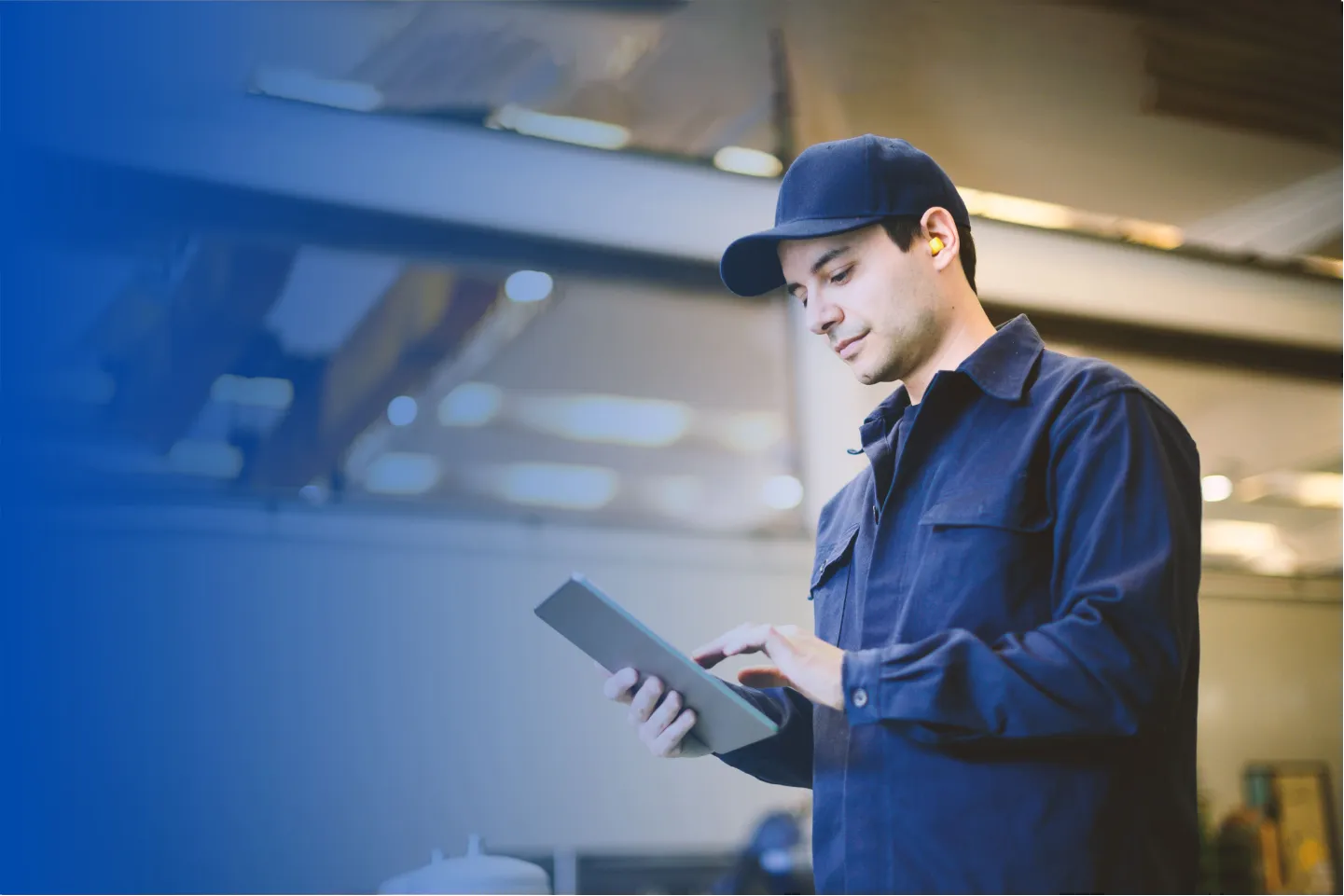 Commercial technician using a tablet on a job site